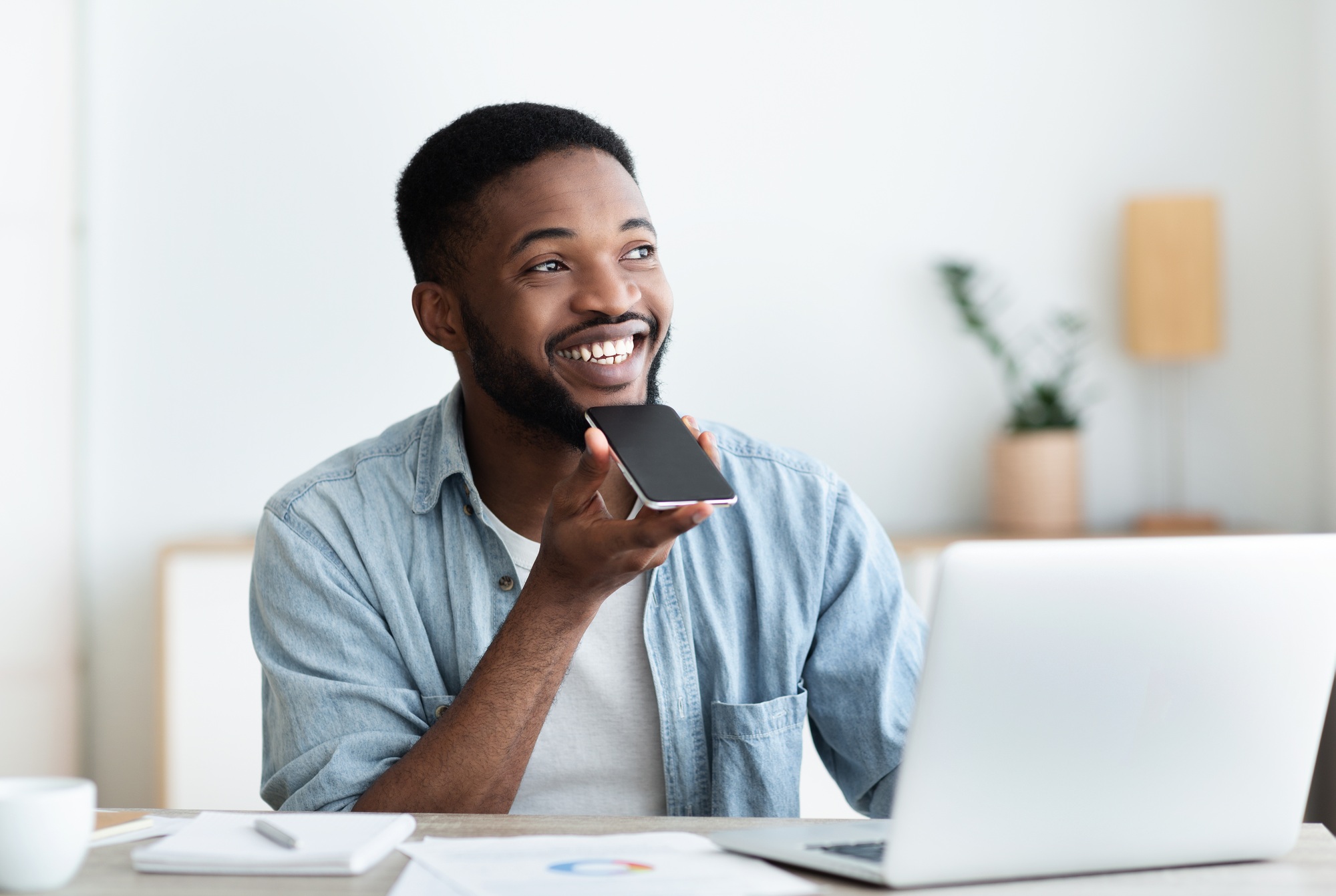 African American Guy Using Voice Assistant On Cellphone